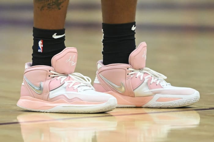 View of pink and white Nike Kyrie shoes.